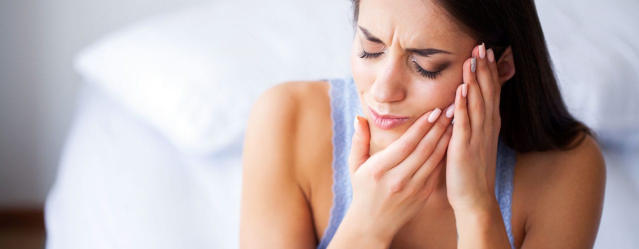 Woman Suffering From TMJ Pain